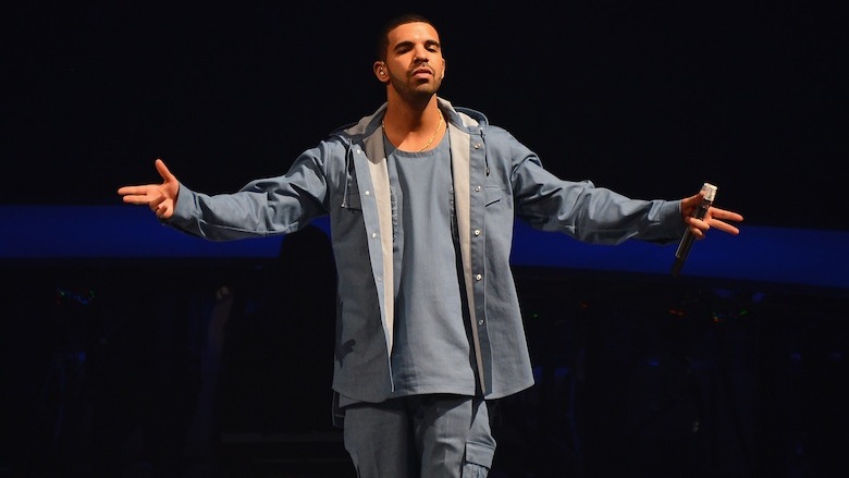 Drake performs at a concert.