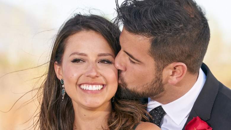 Blake Moynes kissing Katie Thurston's cheek.