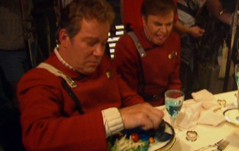Notice the look of disgust on the face of Walter Koenig as Shatner fiddles with the blue food.