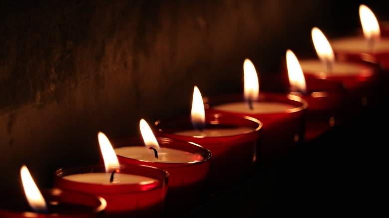 A row of lit tealights
