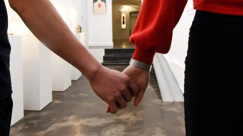 Couple holding hands