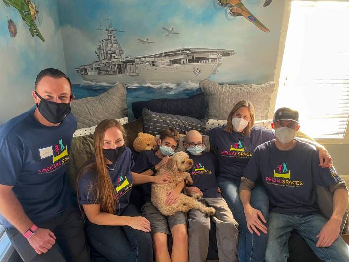Mina with Luke and his family in his brand new room
