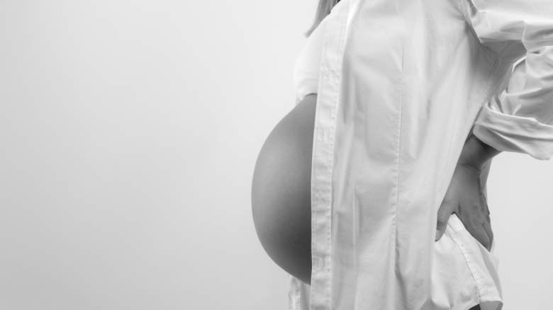 A pregnant woman.