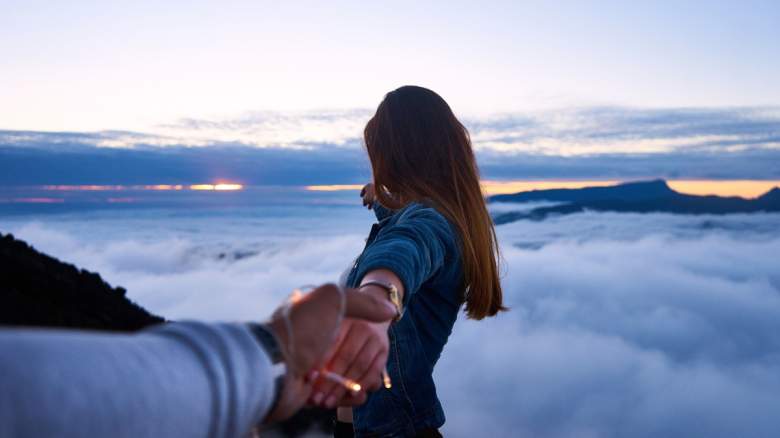 A man and woman holding hands.