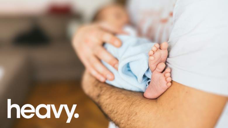 Dad holding newborn