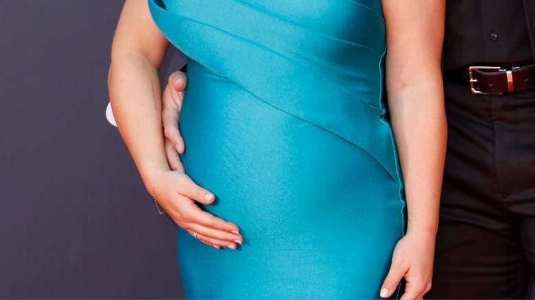 A pregnant woman.