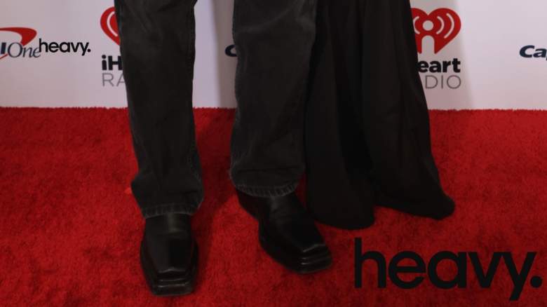 People standing on a red carpet.