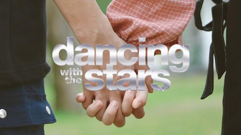 A couple holding hands.