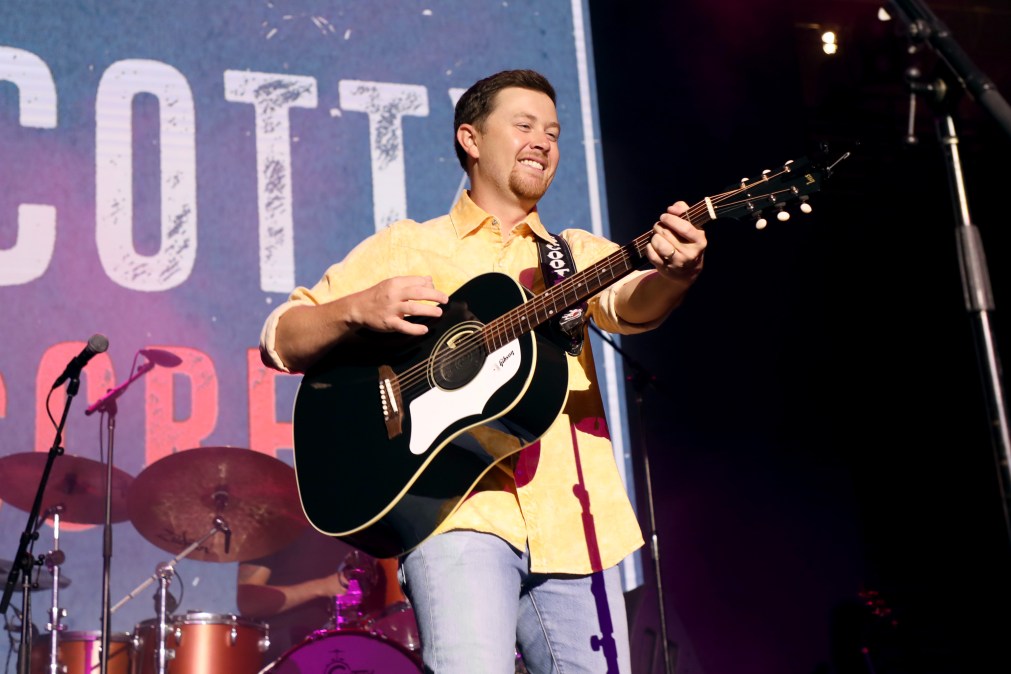 Scotty McCreery playing guitar