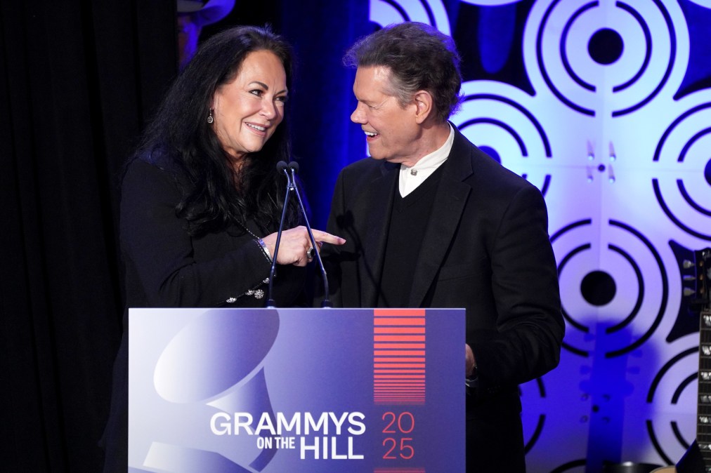 Randy Travis on stage with his wife, Mary Travis