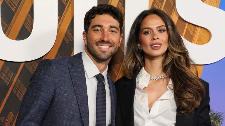 Joey Graziadei and Kelsey Anderson smiling at event