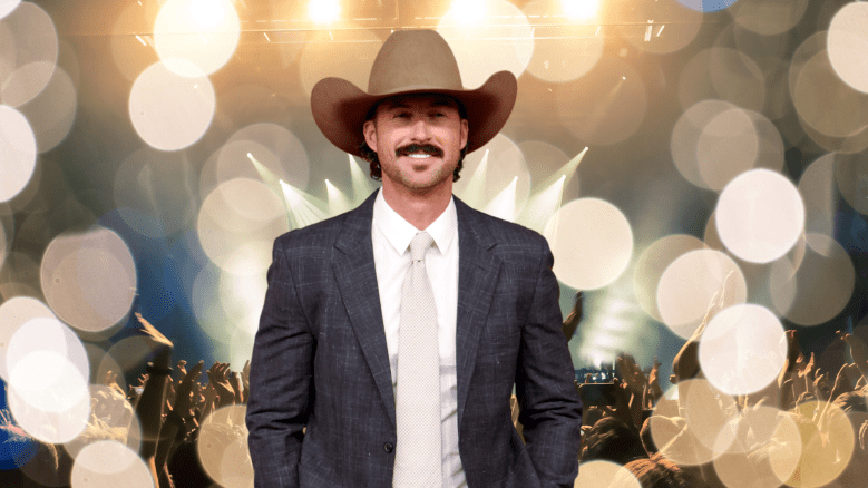 Riley Green smiling in a cowboy hat