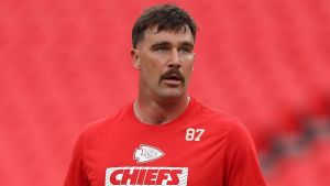 Travis Kelce #87 of the Kansas City Chiefs walks on the field in pregame warmups prior to a preseason game against the Chicago Bears at GEHA Field at Arrowhead Stadium on August 22, 2024