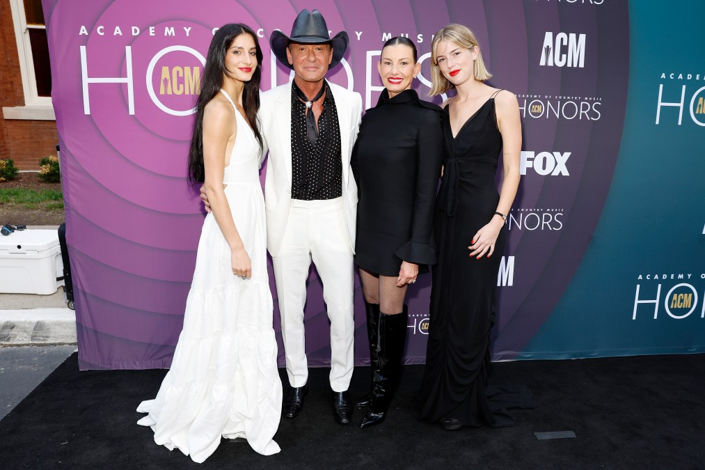Audrey McGraw posing with her parents and sister.