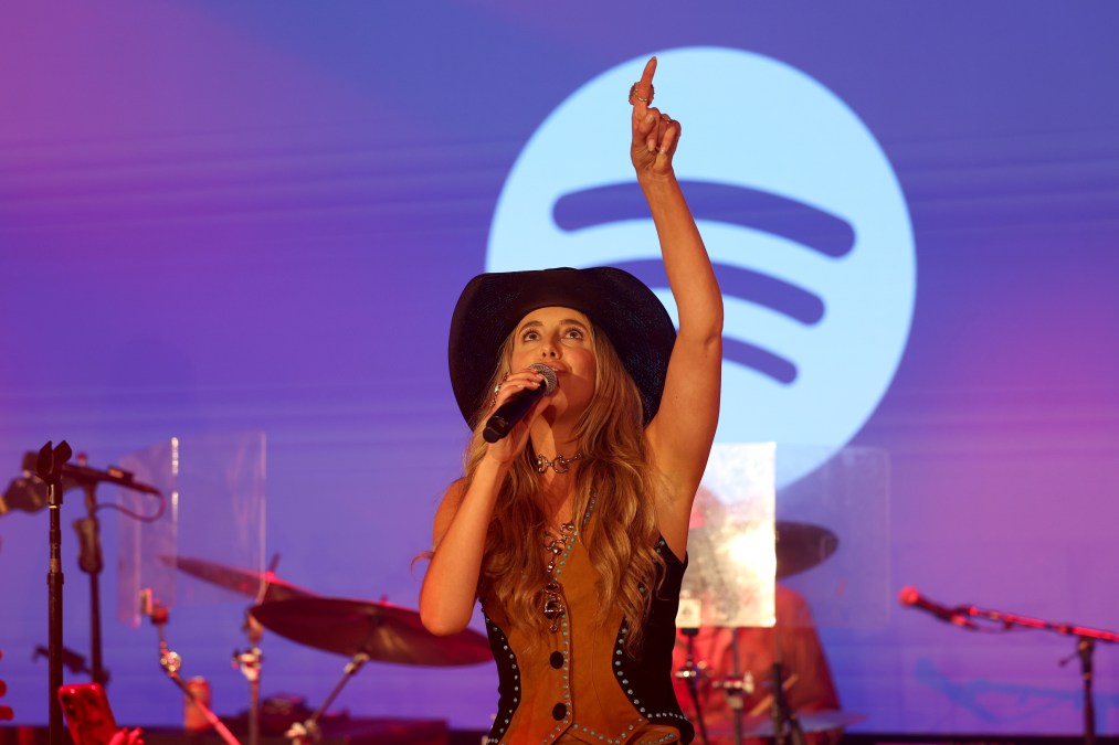Lainey Wilson performing on stage.