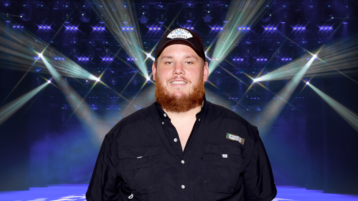Luke Combs posing on stage