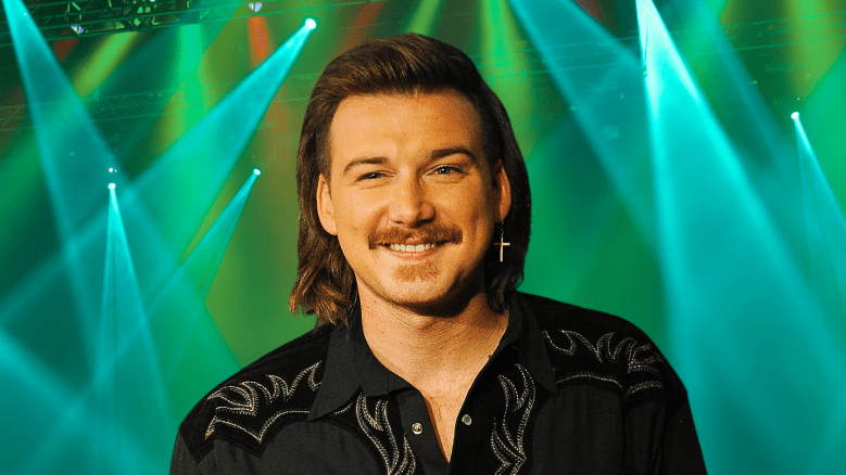 Morgan Wallen smiling with an earring