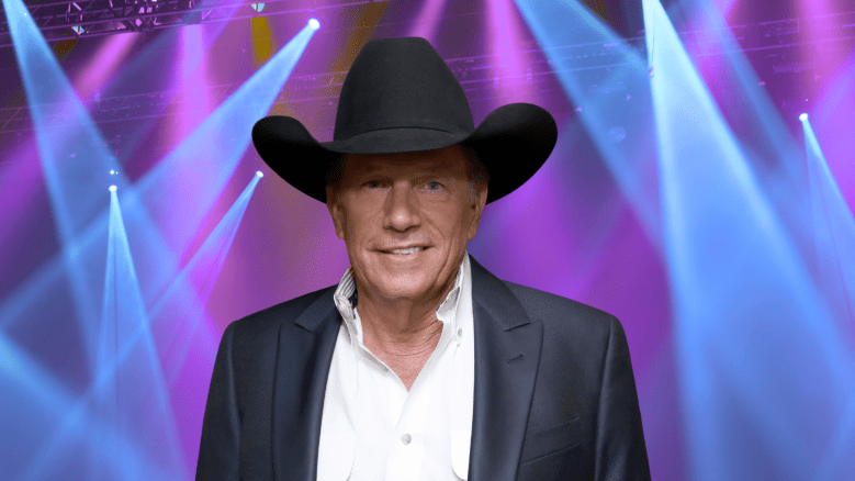George Strait posing in a cowboy hat.