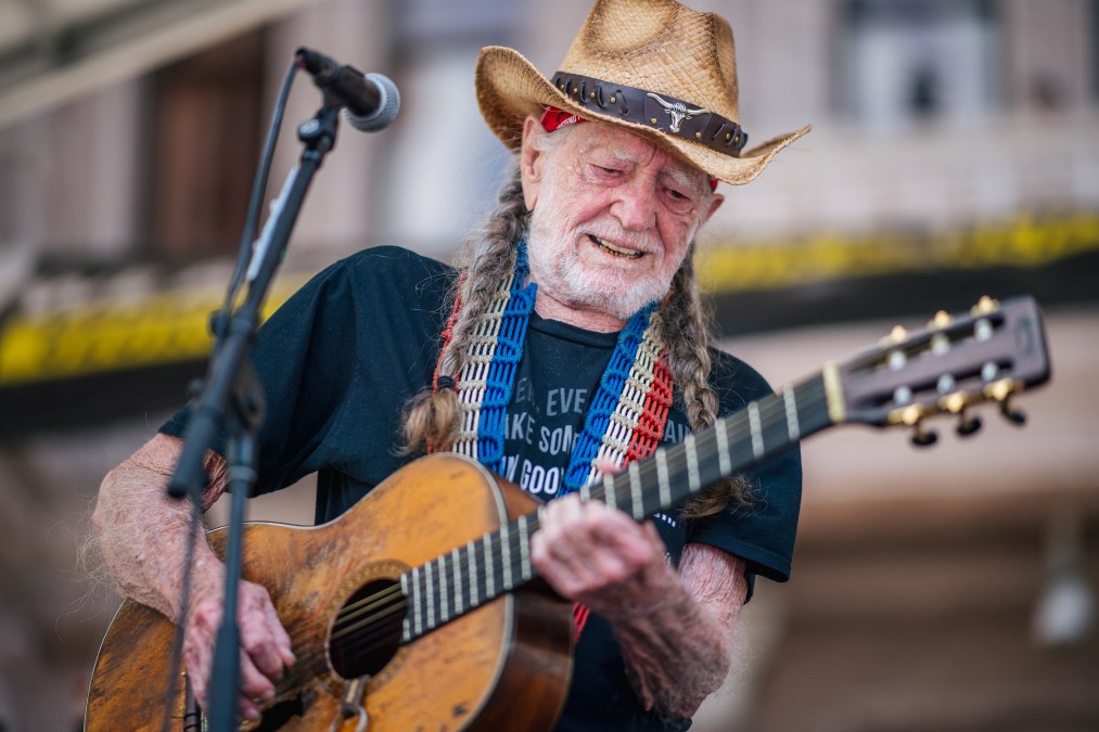 Willie Nelson playing guitar