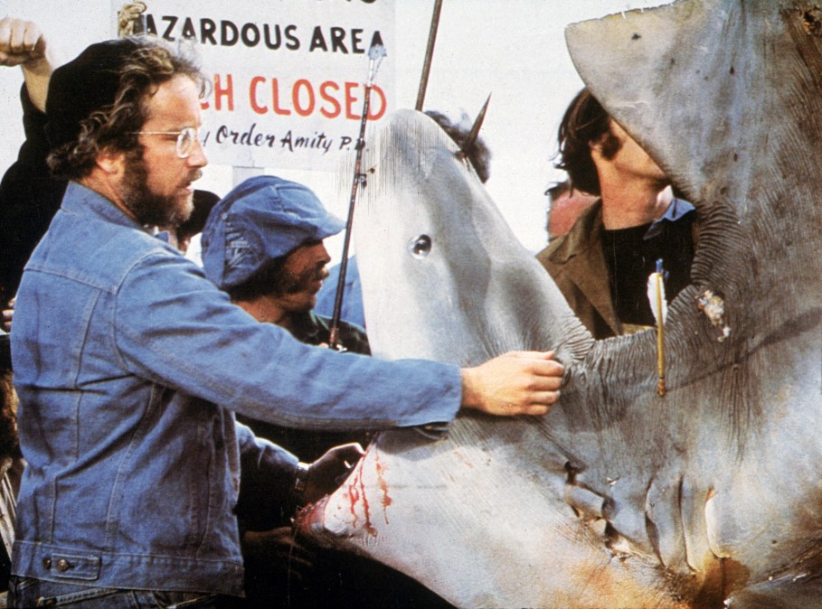 American actor Richard Dreyfuss inspects the mouth of a dead Great White shark