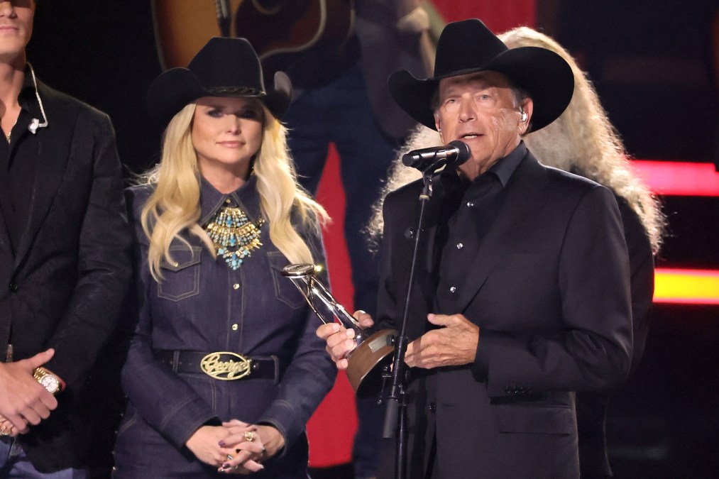 George Strait and Miranda Lambert standing together