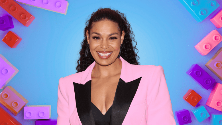 Jordin Sparks smiling in a pink blazer.
