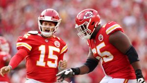 Patrick Mahomes #15 of the Kansas City Chiefs celebrates with Trey Smith #65 after throwing a touchdown pass during the fourth quarter at Arrowhead Stadium on September 12, 2021 in Kansas City, Missouri