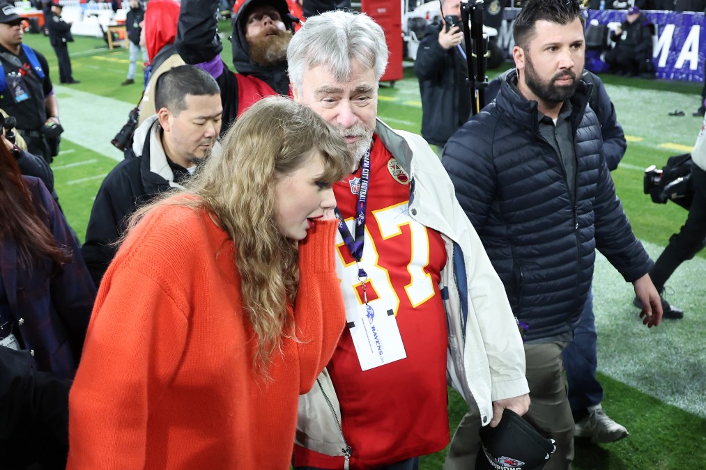 Taylor Swift is seen on the field with Ed Kelce