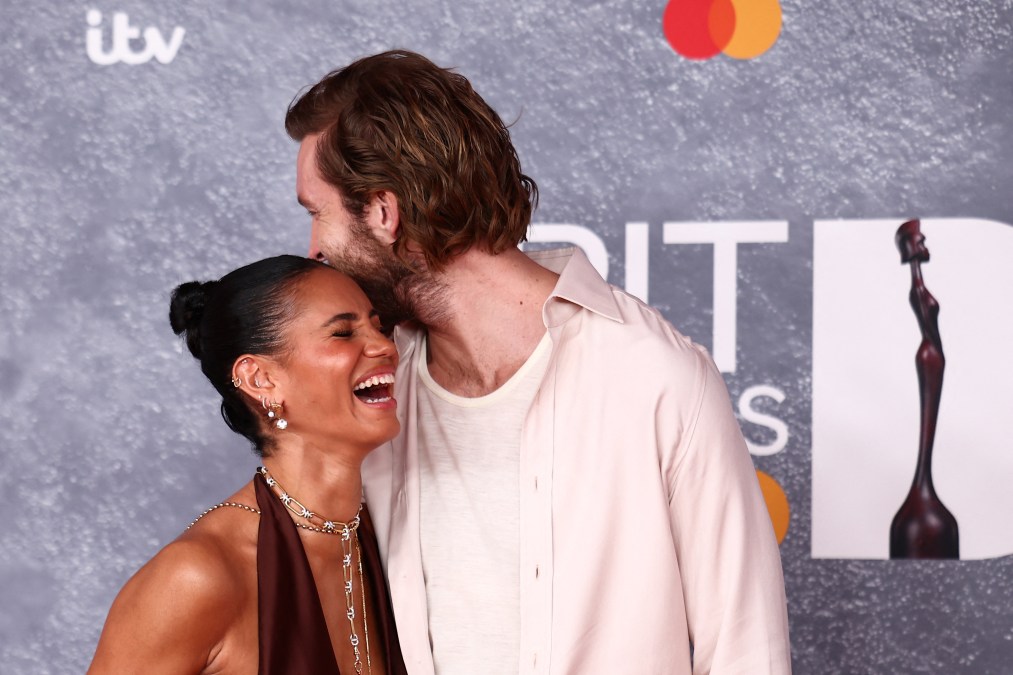 British DJ Calvin Harris (R) and his wife British TV presenter Vick Hope 