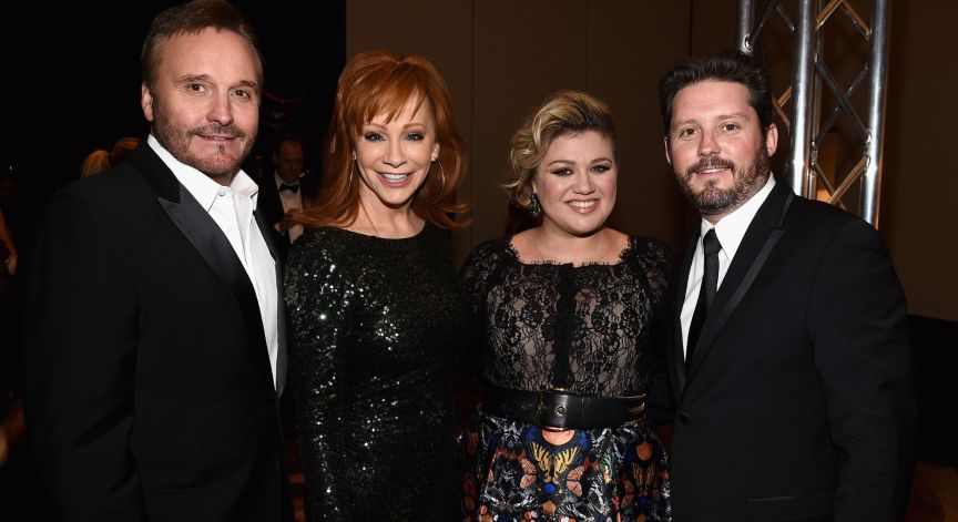 TV Producer Narvel Blackstock, singers Reba McEntire, Kelly Clarkson and Brandon Blackstock attend Muhammad Ali's Celebrity Fight Night XXI at the JW Marriott Phoenix Desert Ridge Resort & Spa on March 28, 2015 in Phoenix, Arizona