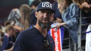 Former U.S. Olympic swimmer Michael Phelps walks down the sideline after the 2025 SheBelieves Cup at State Farm Stadium between the United States and Australia on February 23, 2025