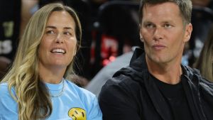 Julie Brady (L) and her brother, Tampa Bay Buccaneers quarterback Tom Brady, attend a game between the Connecticut Sun and the Las Vegas Aces at Michelob ULTRA Arena on May 31, 2022