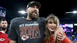 Travis Kelce #87 of the Kansas City Chiefs celebrates with Taylor Swift after a 17-10 victory against the Baltimore Ravens in the AFC Championship Game