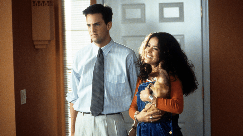 Matthew Perry and Salma Hayek enter a home in a scene from the film 'Fools Rush In',