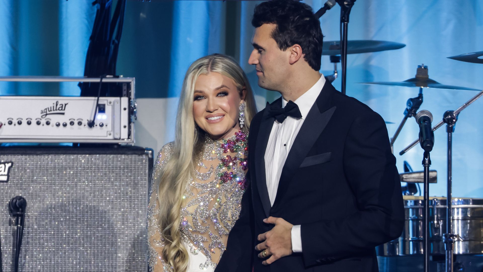 Charlie Kirk (R) and and his wife Erika Lane Frantzve (L) on stage during the Turning Point USA Inaugural-Eve Ball at the Salamander Hotel on January 19, 2025