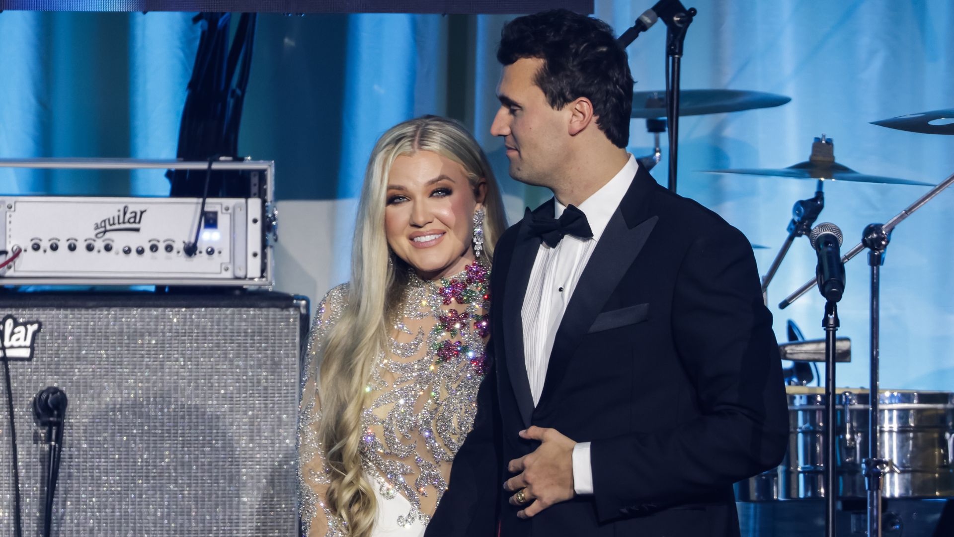 Charlie Kirk (R) and and his wife Erika Lane Frantzve (L) on stage during the Turning Point USA Inaugural-Eve Ball at the Salamander Hotel on January 19, 2025