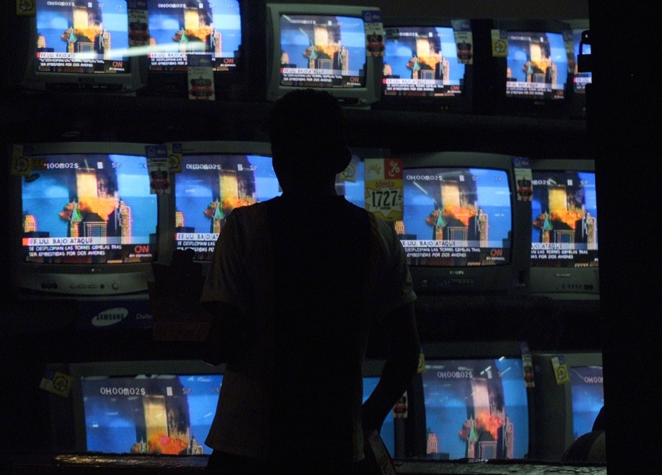 Guatemalan pedestrians watch on TV September 11, 2001 in Guatemala 