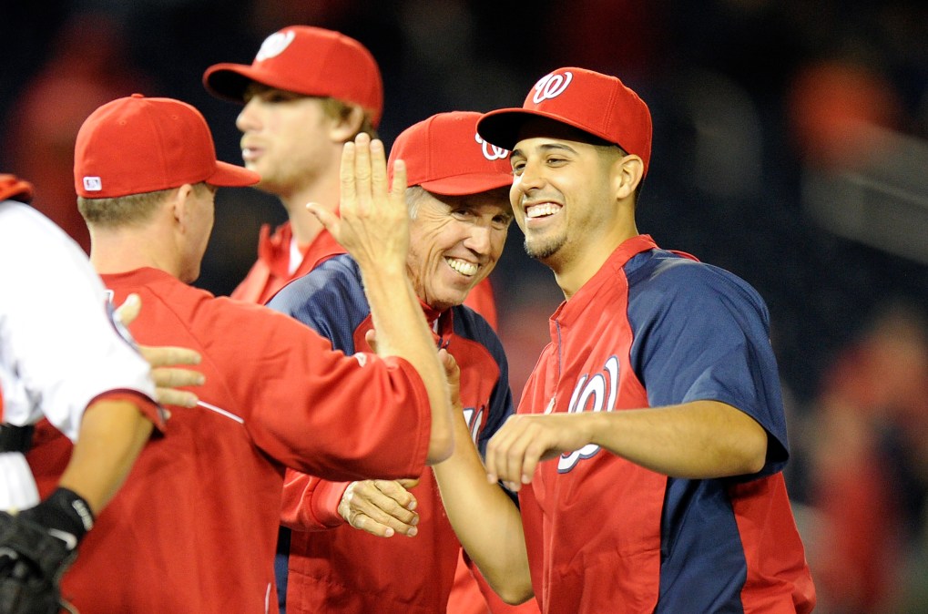 Gio Gonzalez #47 of the Washington Nationals celebrates with manager Davey Johnson 