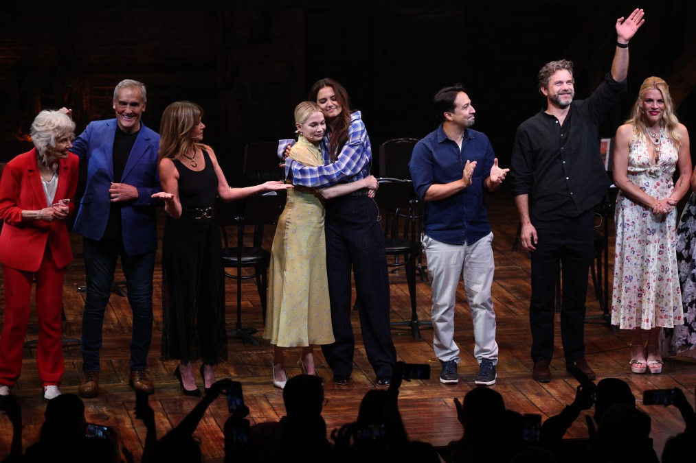 Michelle Williams and Katie Holmes embrace onstage