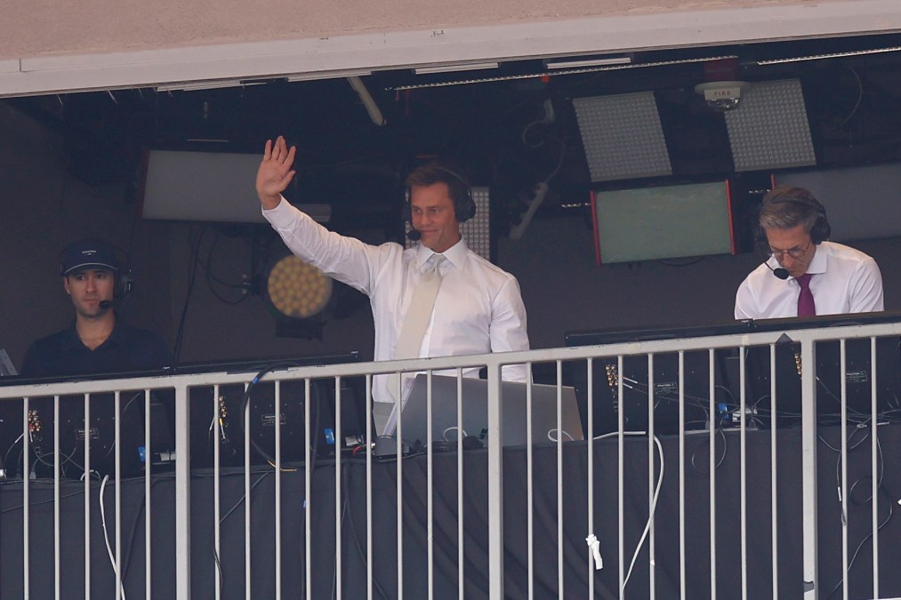 Tom Brady wearing headset.