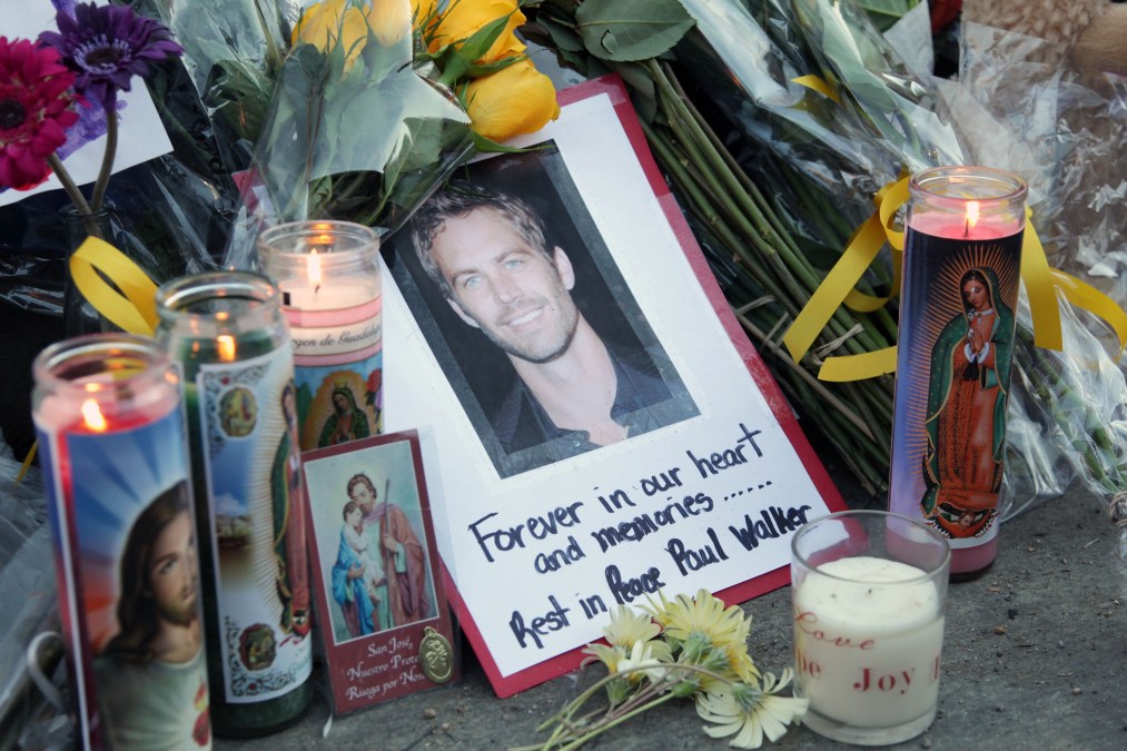 A general view of atmosphere as fans pay tribute to actor Paul Walker at the site of his fatal car accident on December 1, 2013