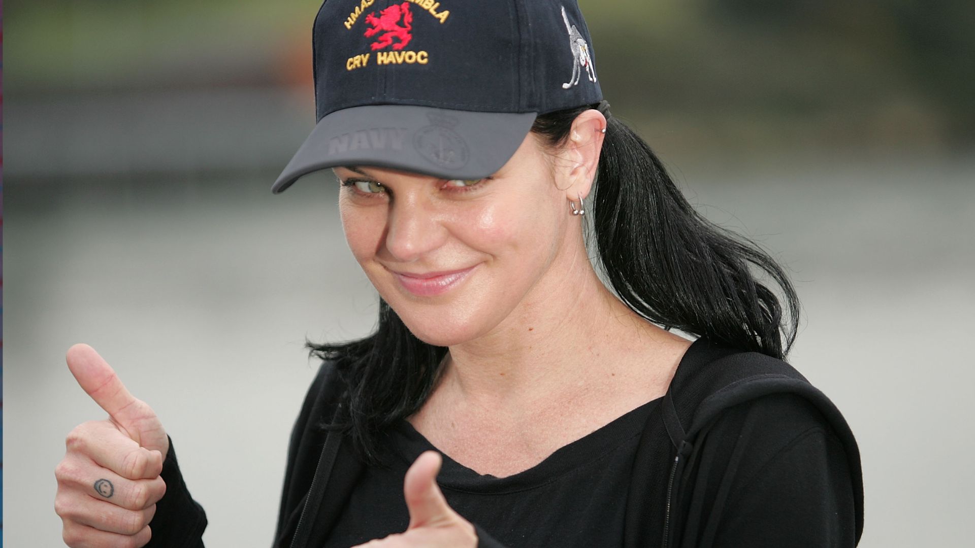 American actress Pauley Perrette poses as she meets with the Australian Defence Force Investigative Service (ADFIS), aboard HMAS Kanimbla at Garden Island on June 1, 2010