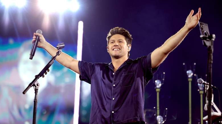 Niall Horan performing onstage, smiling