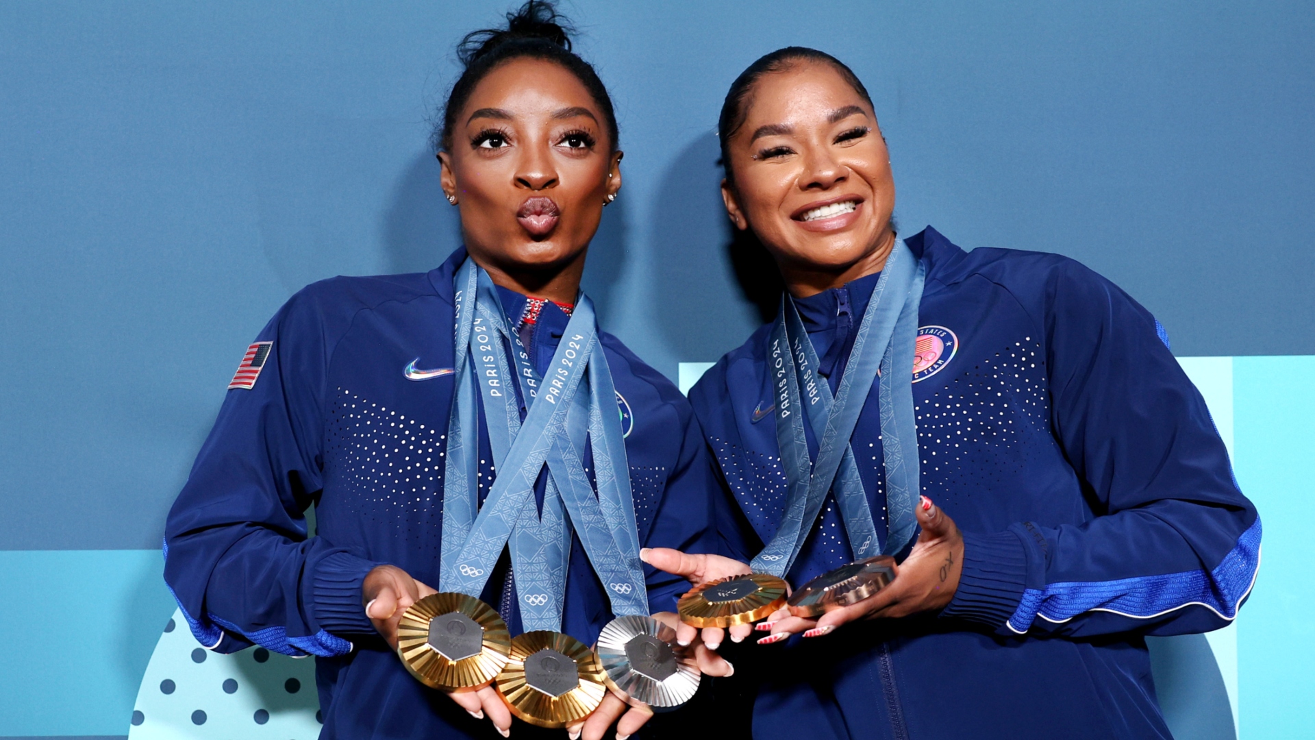 Simone Biles and Jordan Chiles pose with their medals