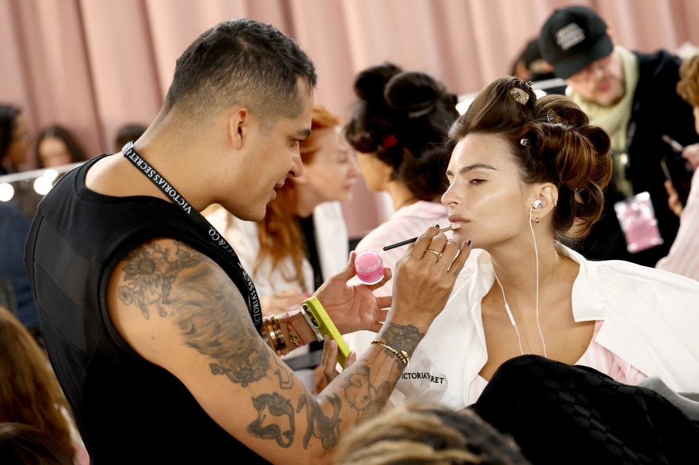 Emily Ratajkowski prepares backstage at the Victoria's Secret Fashion Show 2025