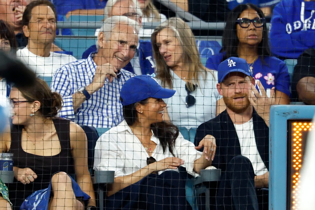 Prince Harry and Meghan Markle sitting down.