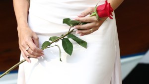 Woman holding a red rose