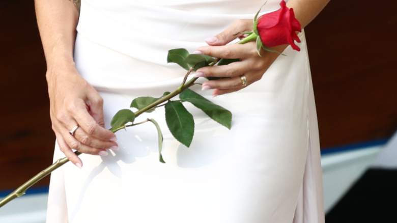 Woman holding a red rose