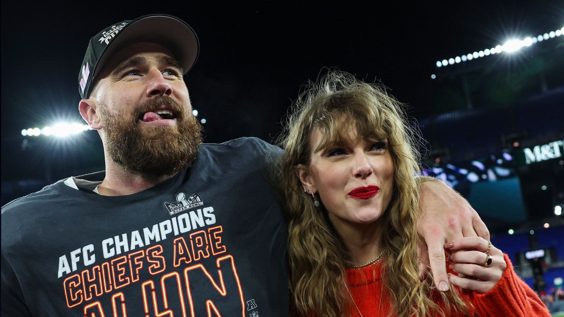 Travis Kelce #87 of the Kansas City Chiefs (L) celebrates with Taylor Swift after defeating the Baltimore Ravens in the AFC Championship Game at M&T Bank Stadium on January 28, 2024