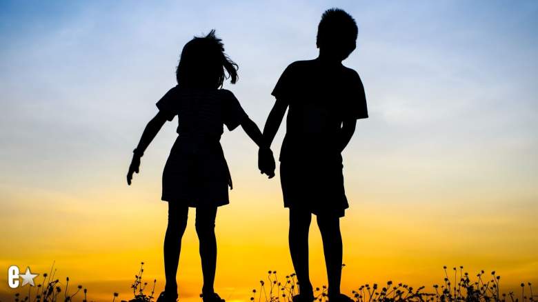 Brother and sister holding hands